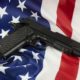 Interview with Gun Rights Advocate and Researcher John Lott gun-in-front-of-flag-feat-e38fbe6441f2c5c4883d4edc7f4a507613cb578f